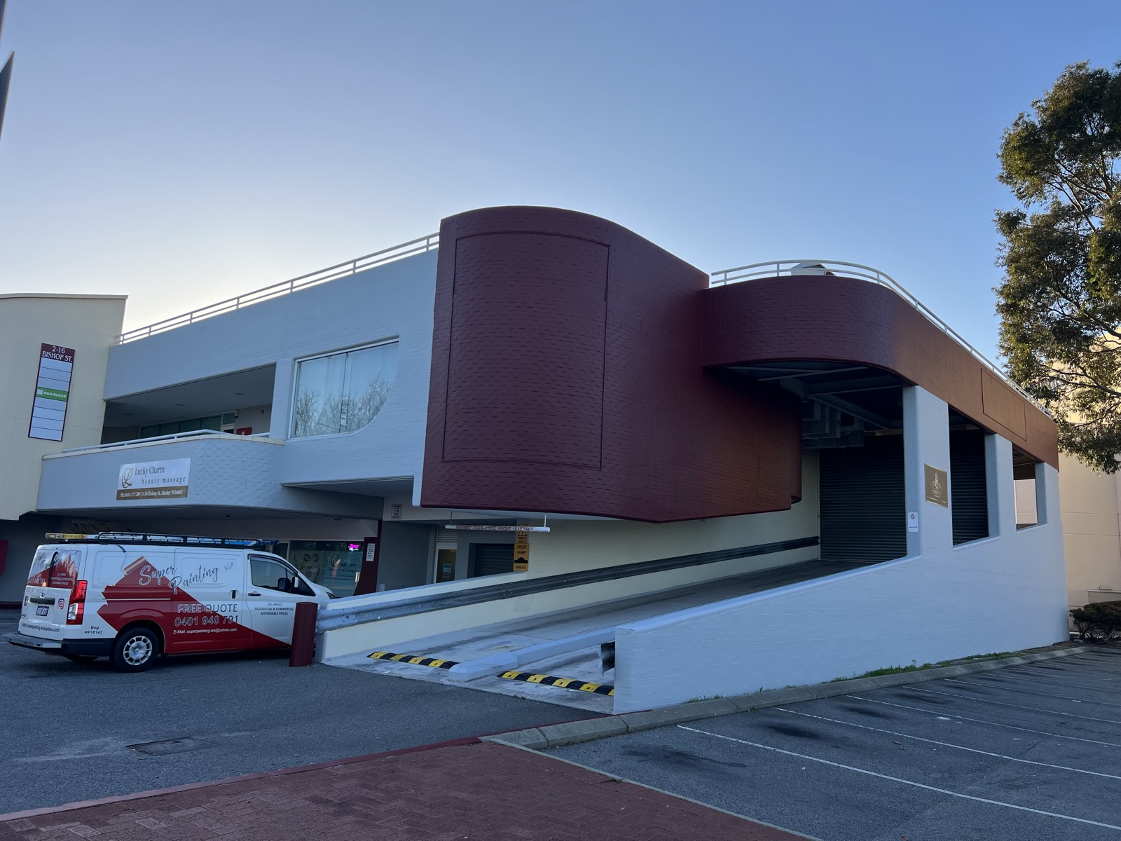 Super Painting WA van at a completed commercial building repaint in Perth